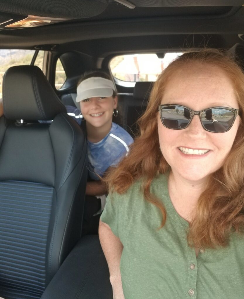 Author and daughter sitting inside RAV4